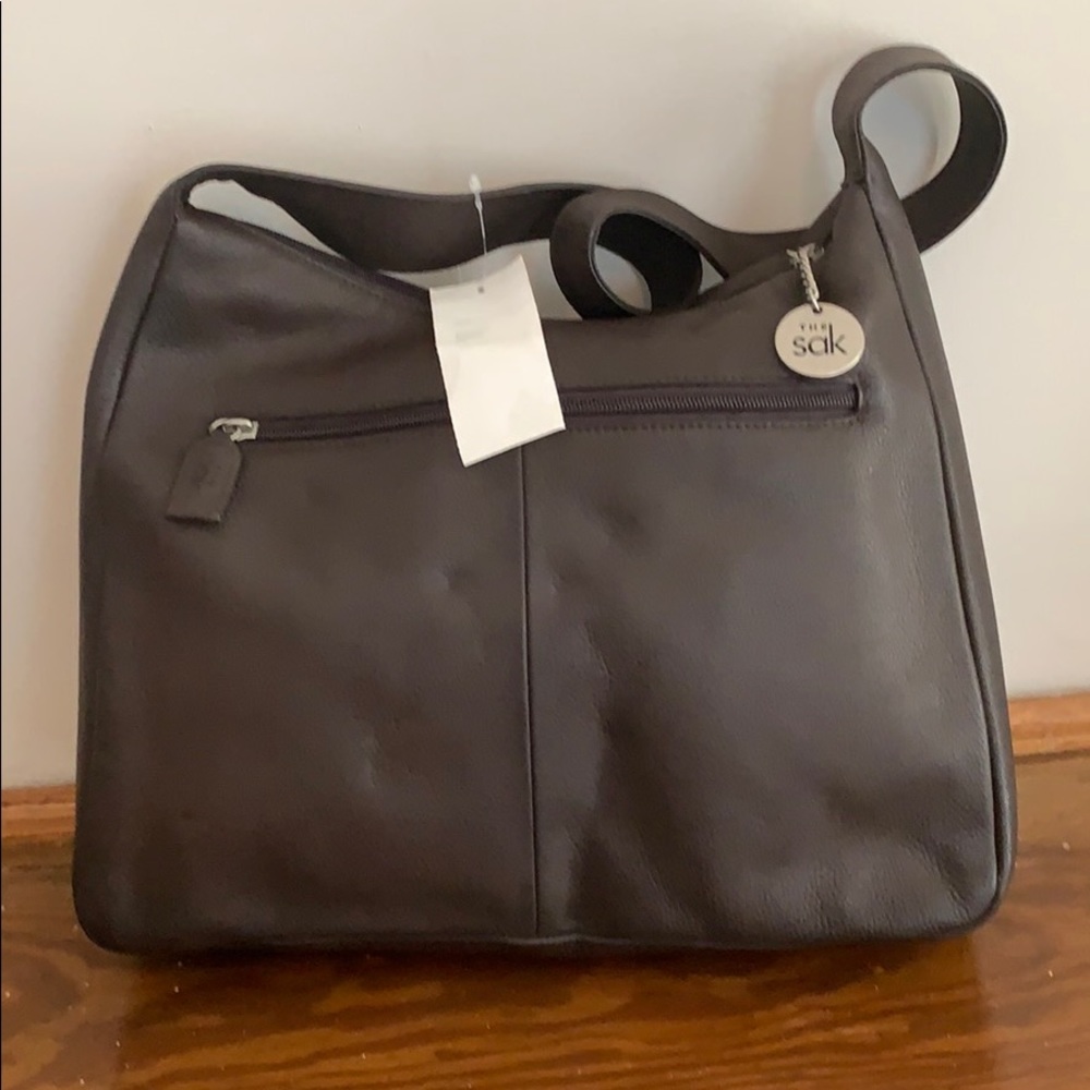 Brown leather purse by The Sak